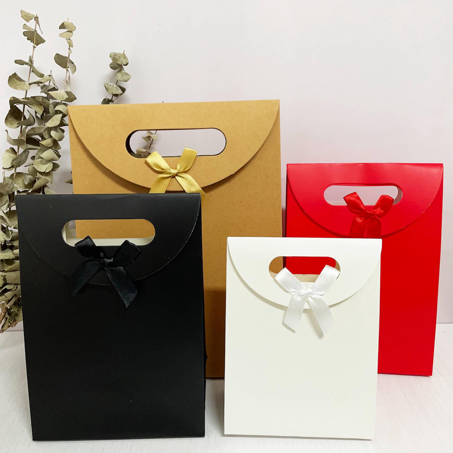 Unique-Shaped Cardboard Gift Bag — Artistic &amp; Sustainable Packaging